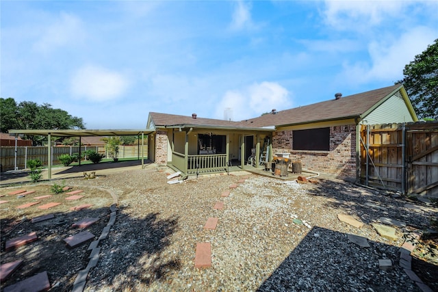 back of house with a patio area