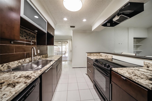 kitchen with a textured ceiling, light tile patterned floors, sink, and black appliances