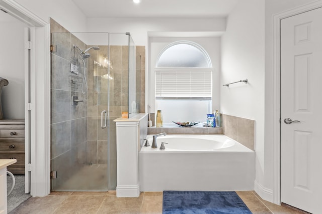 bathroom featuring independent shower and bath and tile patterned flooring