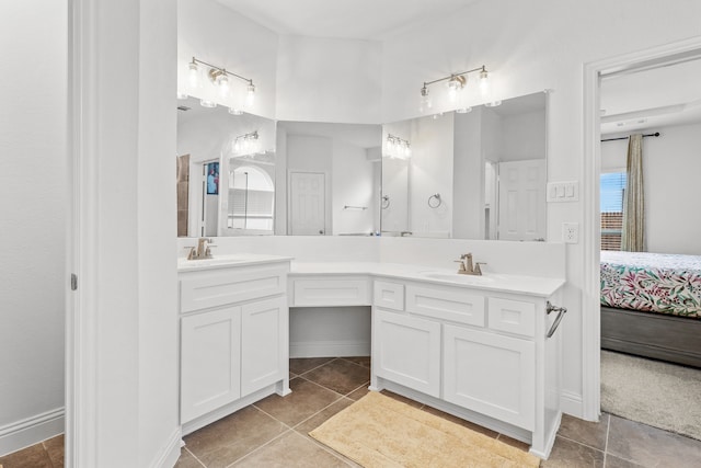 bathroom with vanity, tile patterned floors, and a wealth of natural light