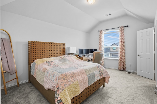 bedroom featuring carpet floors and vaulted ceiling