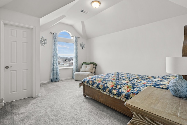 carpeted bedroom featuring lofted ceiling