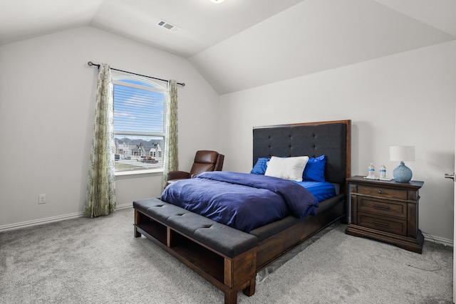 bedroom featuring light carpet and lofted ceiling