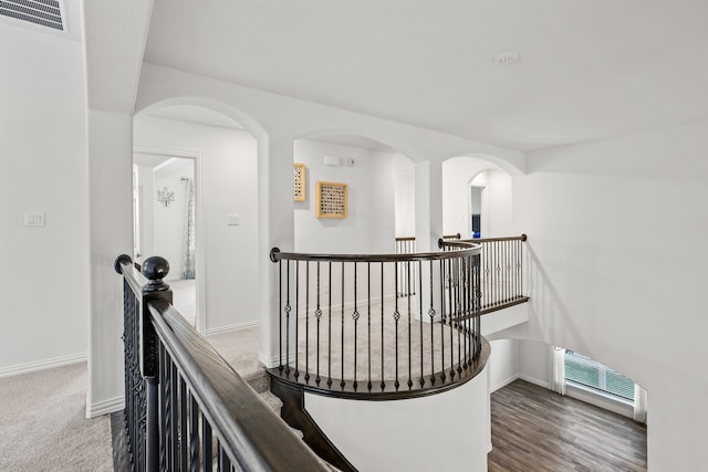 hallway with dark hardwood / wood-style floors