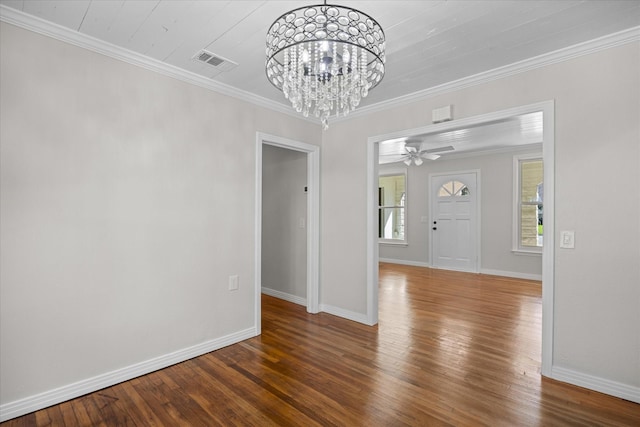 unfurnished dining area featuring a chandelier, dark hardwood / wood-style floors, and ornamental molding