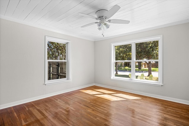 spare room featuring wood ceiling, ceiling fan, wood-type flooring, and ornamental molding