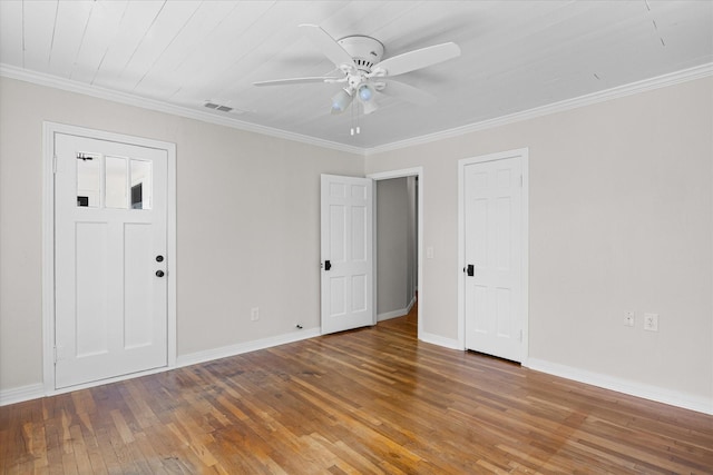 unfurnished room with ceiling fan, wood-type flooring, and crown molding