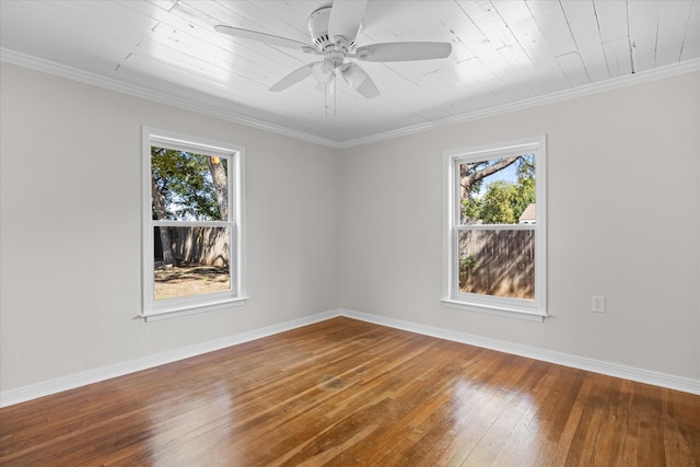 spare room with hardwood / wood-style floors, ceiling fan, ornamental molding, and wood ceiling