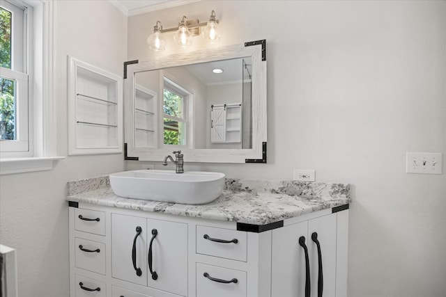 bathroom featuring vanity and ornamental molding