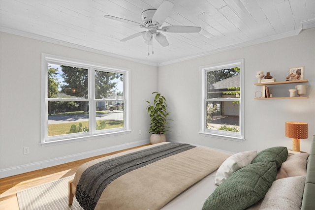 bedroom with hardwood / wood-style floors, ceiling fan, wooden ceiling, and ornamental molding