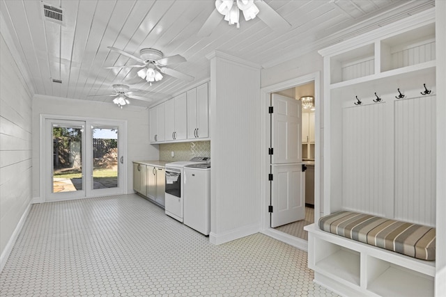 kitchen featuring separate washer and dryer, white cabinetry, ornamental molding, and wood ceiling