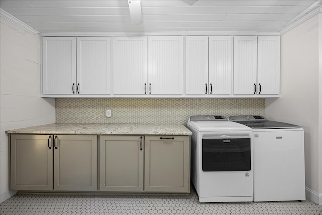 washroom with cabinets, independent washer and dryer, ornamental molding, and light tile patterned floors