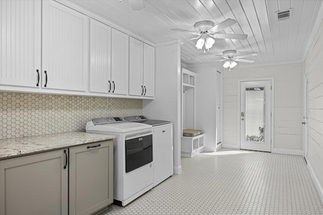 laundry area featuring cabinets, ornamental molding, wood ceiling, ceiling fan, and washer and dryer