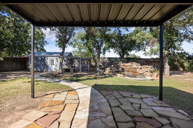 view of patio / terrace with an outbuilding