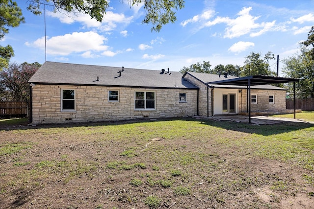 rear view of property featuring a yard and a patio