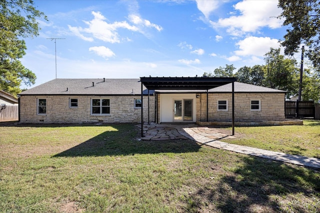 back of property featuring a lawn and a pergola