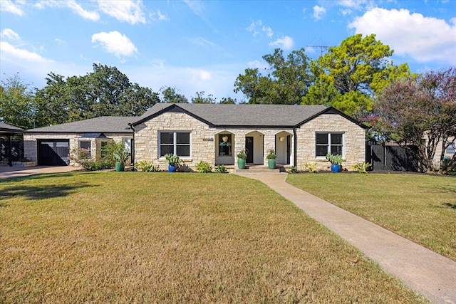 single story home featuring a garage and a front lawn