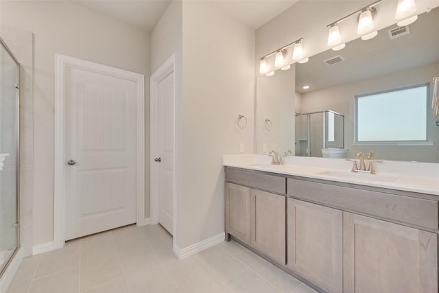 100 Skyward Ln, Caddo Mills, TX 75135 - bathroom featuring a shower stall, double vanity, tile patterned flooring, and baseboards