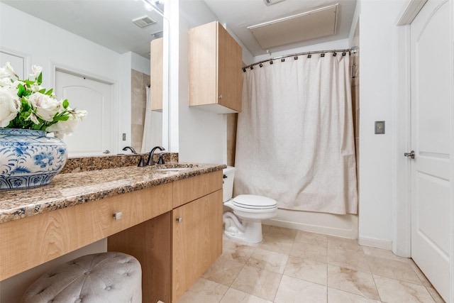 full bathroom featuring vanity, shower / bath combo, and toilet