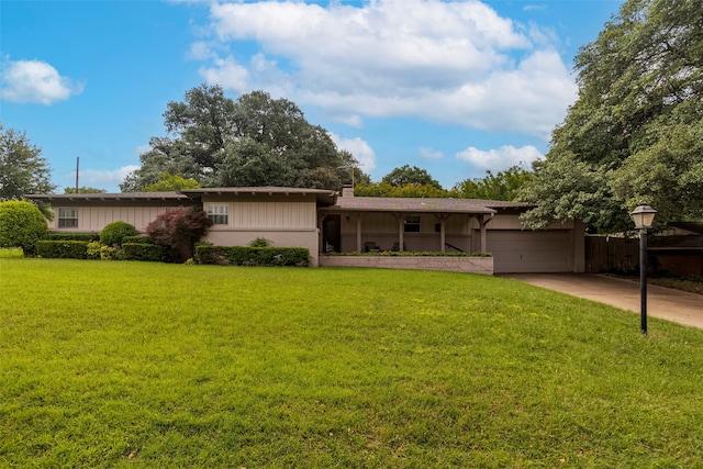 single story home featuring a front lawn and a garage