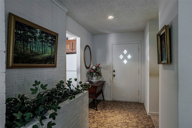 interior space featuring a textured ceiling