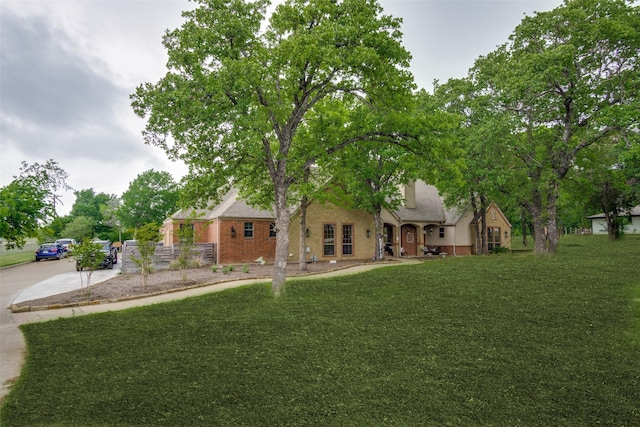 view of front of home with a front lawn