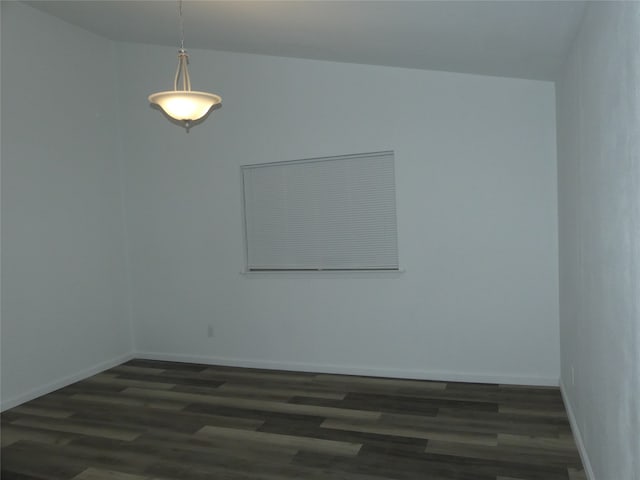 unfurnished room featuring dark hardwood / wood-style flooring