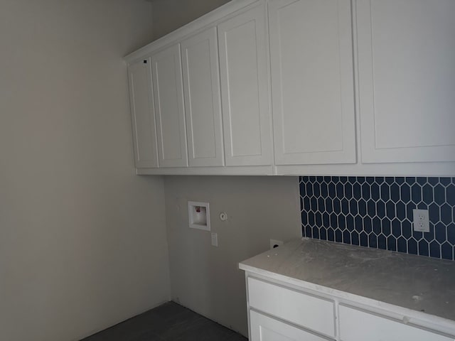 laundry area with washer hookup and cabinets