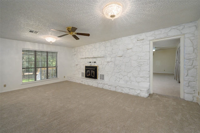 unfurnished living room featuring ceiling fan, a textured ceiling, and carpet flooring