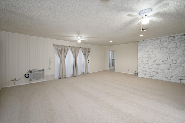1498 Riley Rd, Whitesboro, TX 76273 - unfurnished room with ceiling fan, a textured ceiling, carpet, and a wall mounted AC