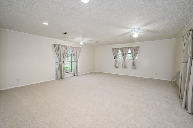 1498 Riley Rd, Whitesboro, TX 76273 - spare room featuring a ceiling fan, ornamental molding, a textured ceiling, light carpet, and baseboards