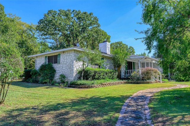1498 Riley Rd, Whitesboro, TX 76273 - single story home with stone siding, a chimney, and a front lawn