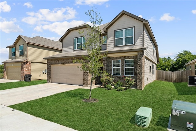 craftsman-style house featuring a garage, central AC unit, and a front yard