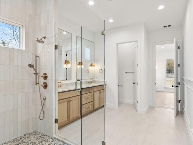 1229 Hunt Rd, Gunter, TX 75058 - bathroom featuring tiled shower, double vanity, recessed lighting, and tile patterned flooring