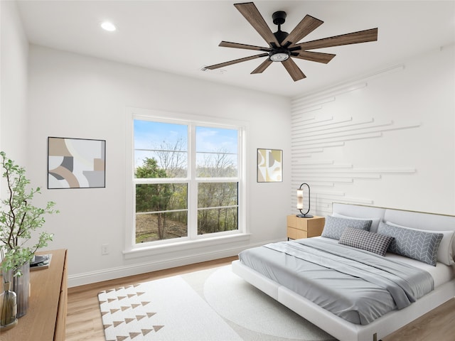 bedroom featuring ceiling fan and light wood-type flooring