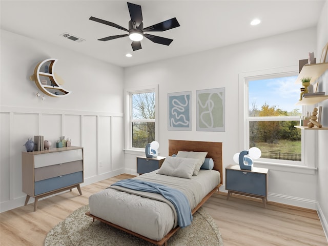 1229 Hunt Rd, Gunter, TX 75058 - bedroom with light wood finished floors, wainscoting, a decorative wall, recessed lighting, and a ceiling fan