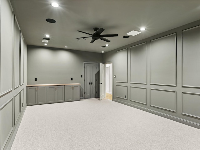 1229 Hunt Rd, Gunter, TX 75058 - carpeted empty room featuring a decorative wall, ceiling fan, and recessed lighting