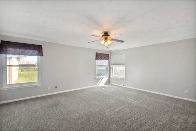 carpeted empty room featuring ceiling fan