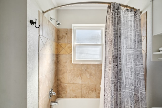 bathroom with shower / bathtub combination with curtain