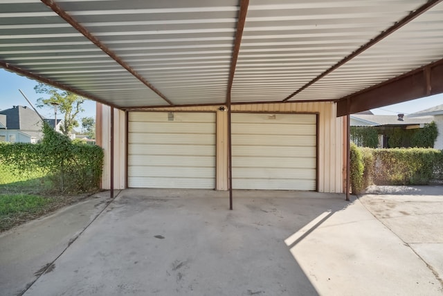 garage featuring a carport