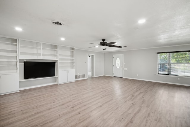 unfurnished living room with light wood-type flooring, ceiling fan, and crown molding