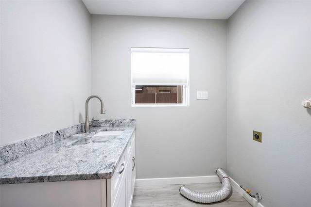 interior space featuring hardwood / wood-style flooring and vanity