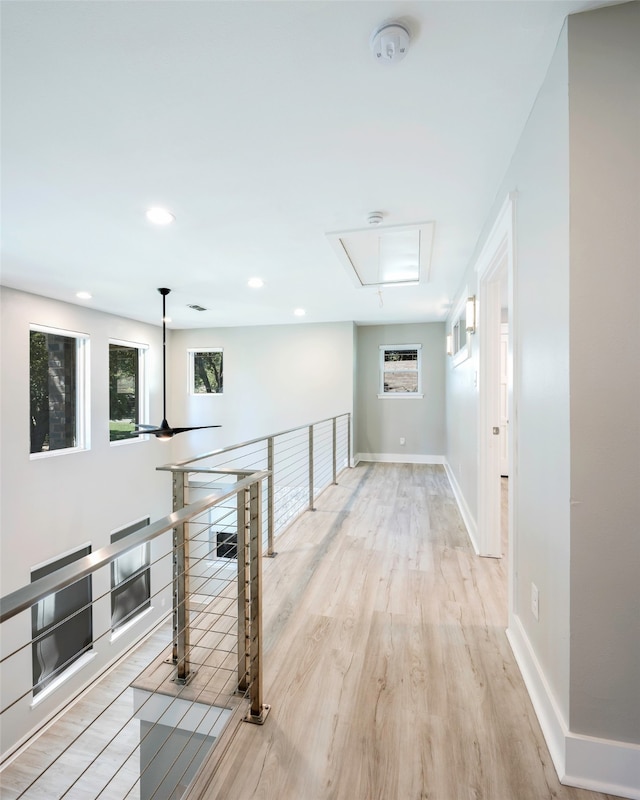 corridor featuring light hardwood / wood-style floors