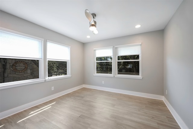 spare room with light hardwood / wood-style flooring