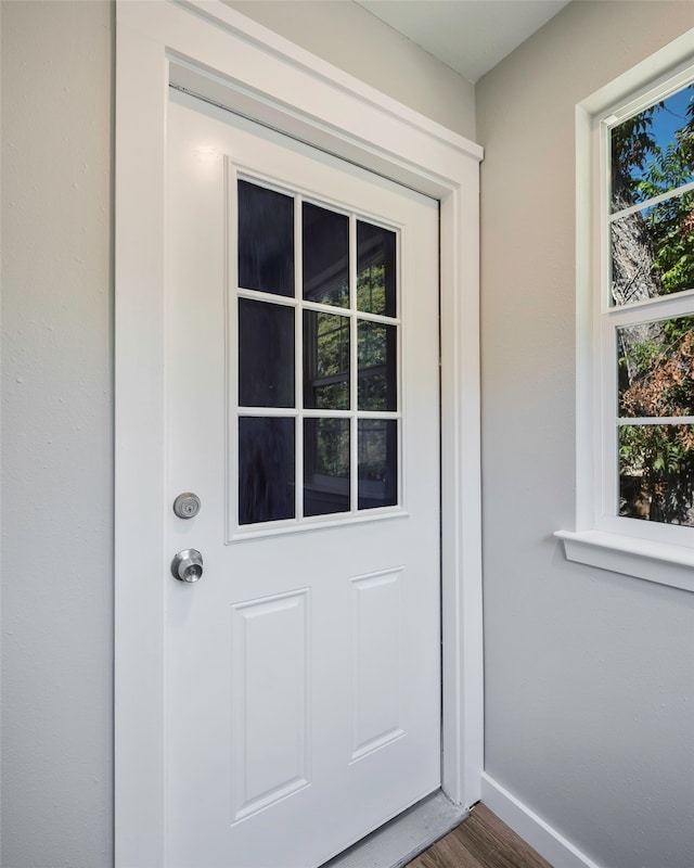 doorway to outside with hardwood / wood-style flooring