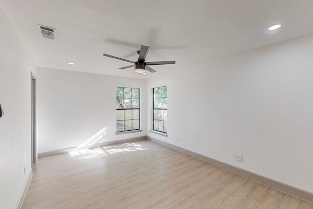 unfurnished room with ceiling fan and light hardwood / wood-style flooring