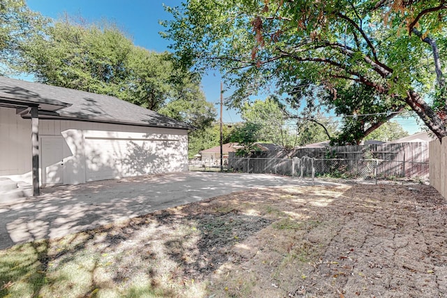 view of yard featuring a garage