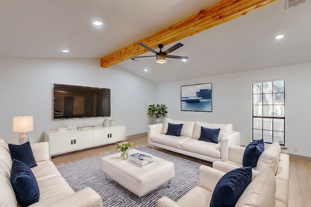 living room with vaulted ceiling with beams, ceiling fan, and light hardwood / wood-style floors