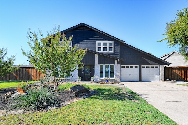 view of front facade featuring a front yard and a garage