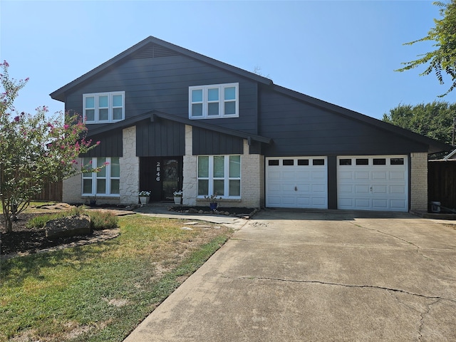 view of front facade with a garage and a front lawn